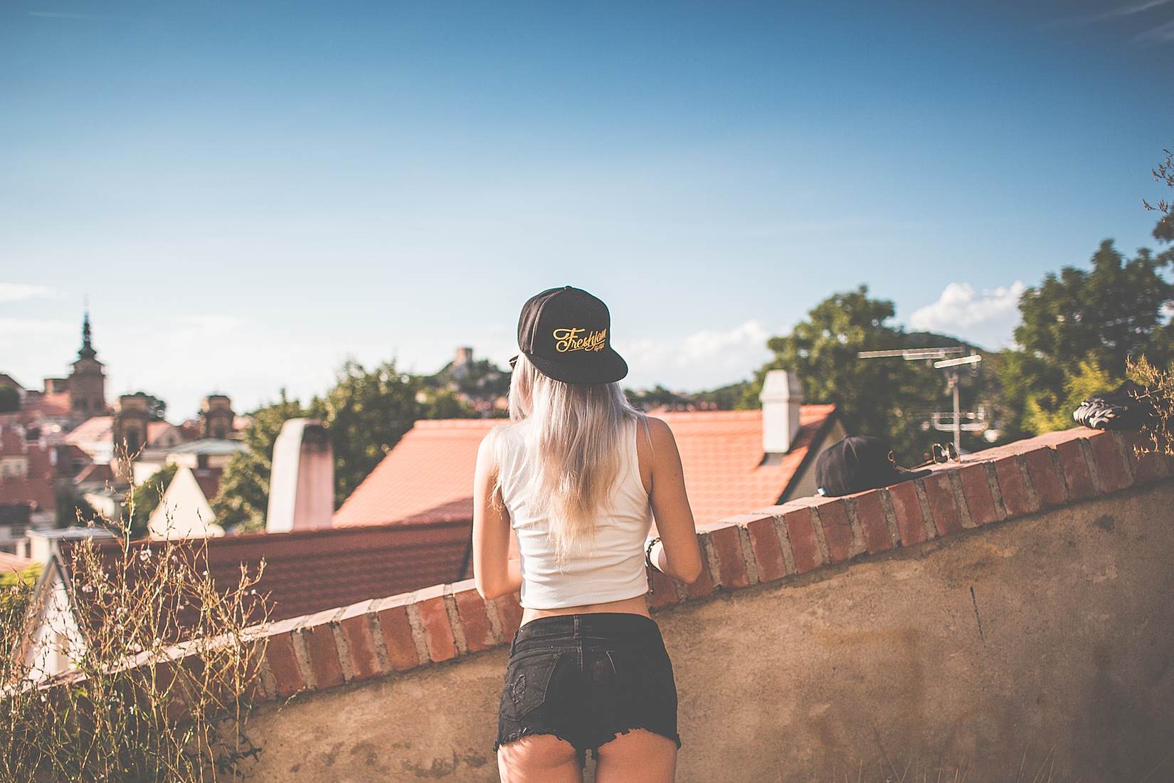 Young Girl with Snapback Looking over the Old City