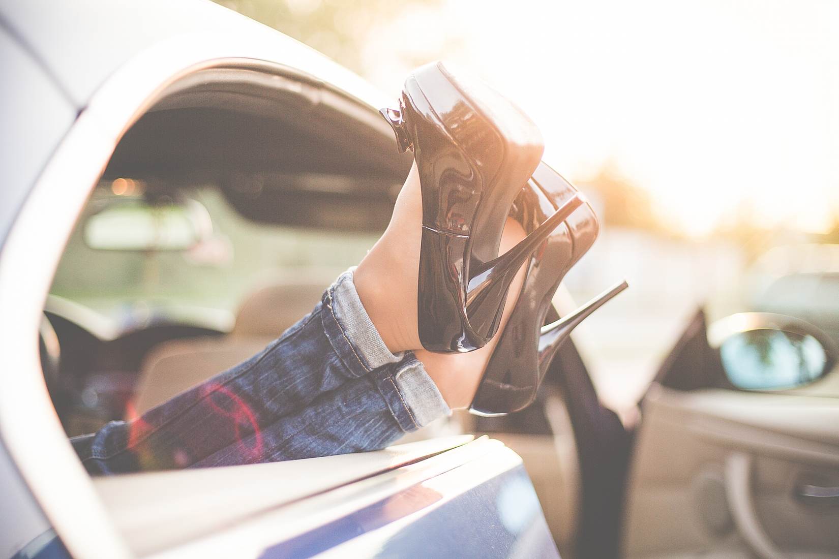 Sexy Woman Legs on High Heels Out of Car Windows